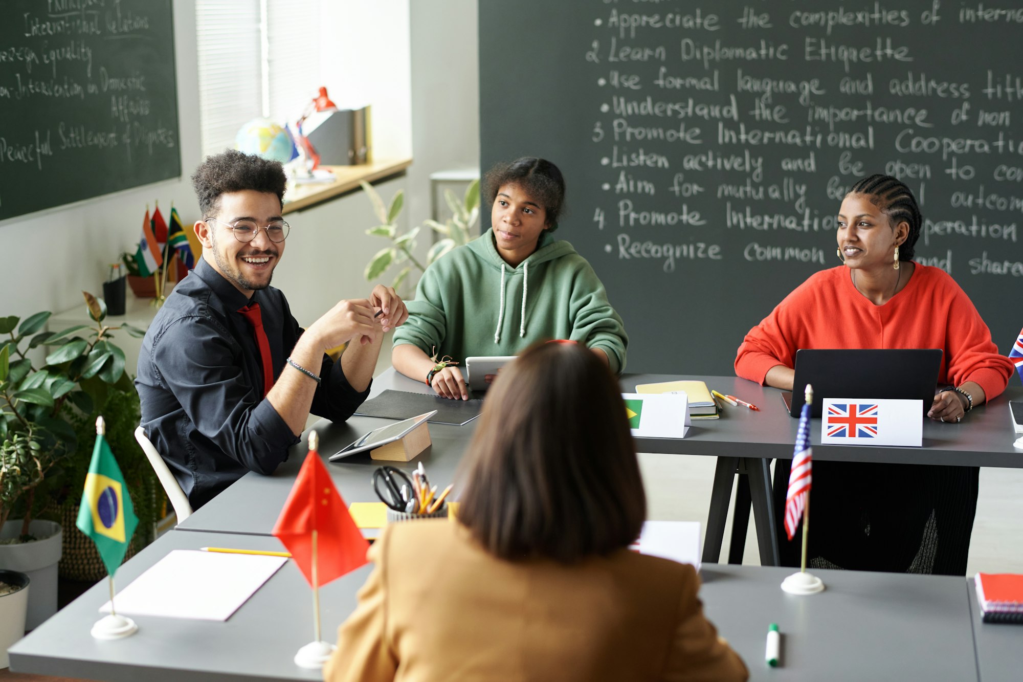 Teacher talking to students at lesson