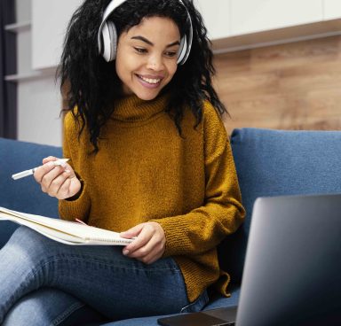 front-view-smiley-teenage-girl-with-headphones-online-school